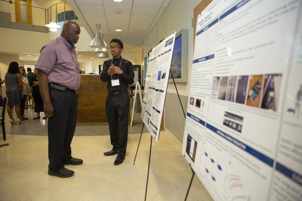 Project ENGAGES students put their research on display in a poster session. (Credit: Sean McNeil, Georgia Tech Research Institute)