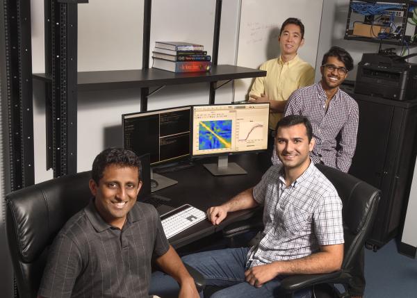 Chethan Pandarinath (front, left) is part of a $1 million NSF grant for decoding massive brain datasets.