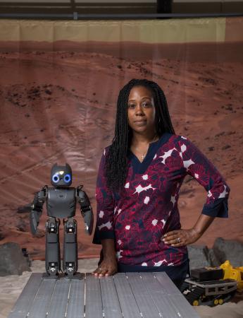 Ayanna Howard, a professor in Georgia Tech's School of Electrical and Computer Engineering, is using this friendly robot to interact with children who are having difficulty with mathematics. The robot uses knowledge from real teachers to help children with common math problems. (Credt: Rob Felt)