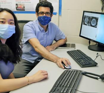 Yutong Guo and Costas Arvanitis sitting at a computer