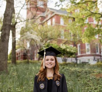 Brielle Lonsberry in cap and gown in front of Tech Tower. (Photo Courtesy: Brielle Lonsberry)