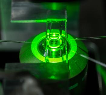 A cell chamber is mounted on a microscope. Three micropipettes, inserted into the chamber from both sides, are used to aspirate individual cells, to bring them into contact so that researchers can study their interactions. This is the kind of methodology that Cheng Zhu and his colleagues used to study PD-1.