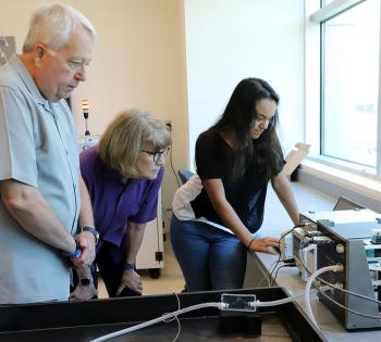 During a lab tour, master’s student Sahar Ibrahim, right, shows Scott and Arline Alexander an example of a 3D-printed vascular structure that can be designed to mimic a specific patient’s anatomy. Ibrahim works with David Frakes, a Coulter BME associate professor. (Photo: Joshua Stewart)