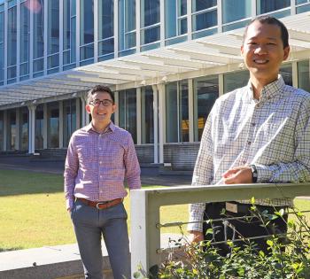 Gabe Kwong, left, and Peng Qiu, who are collaborating on a new project to develop synthetic biosensors capable of basic computing logic. (Photo: Joshua Stewart)