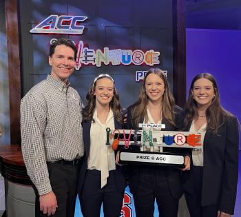 Photo of Neurochamp team members holding ACC InVenture Prize plaque
