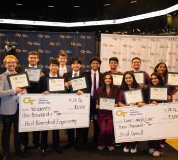 Group photo of Coulter BME Capstone teams. On the far left side of the photo stands Chris Rovell, Profeesor of the Practice and one of the faculty advisors for the BME capstone program. (left to right): Team Valsaviors and Team Liver, Laugh, Love. 