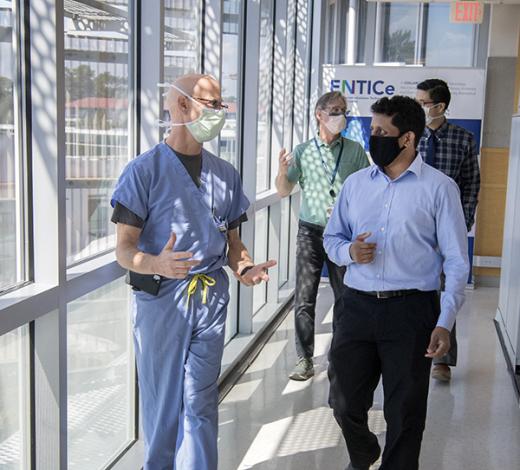This group of clinicians and scientists will collaborate with Chethan Pandarinath, front right, on a $2.4 million, five-year project using artificial intelligence tools to revolutionize the speed and accuracy of brain-machine interfaces. The team includes Robert Gross, front left, a functional neurosurgeon; Jonathan Glass, back left, a neurologist and director of Emory's ALS Center; and Nicholas Au Yong, also a functional neurosurgeon. (Photo: Jack Kearse)