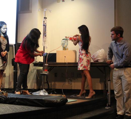 An MBID team presenting their final project for the program.