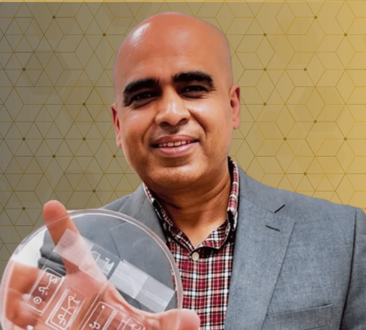 A person holding a clear laboratory petri dish against a gold geometric background with a biomedical research theme.