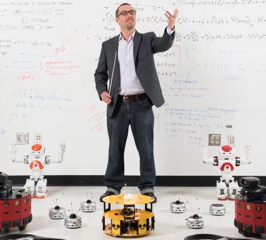 Magnus Egerstedt, a professor in Georgia Tech's School of Electrical and Computer Engineering, is conducting research on controlling swarms of robots that coordinate their own activities to accomplish tasks. (Photo: Rob Felt) Magnus Egerstedt, a professor in Georgia Tech's School of Electrical and Computer Engineering, is conducting research on controlling swarms of robots that coordinate their own activities to accomplish tasks. (Photo: Rob Felt)