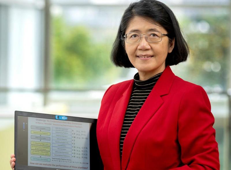 May Wang with a laptop showing some of her data.