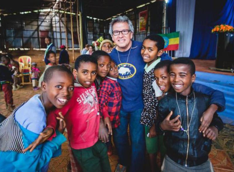 Rudy Gleason in Ethiopia with a group of children.
