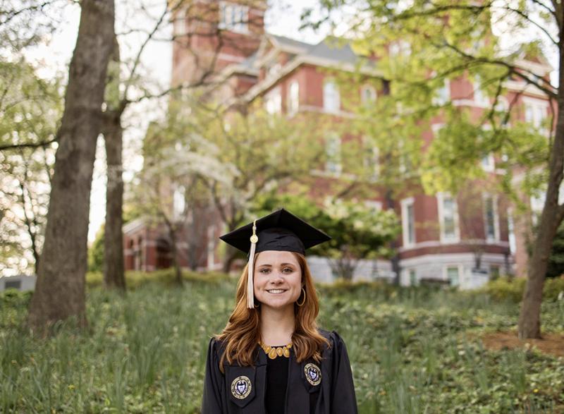 Brielle Lonsberry in cap and gown in front of Tech Tower. (Photo Courtesy: Brielle Lonsberry)