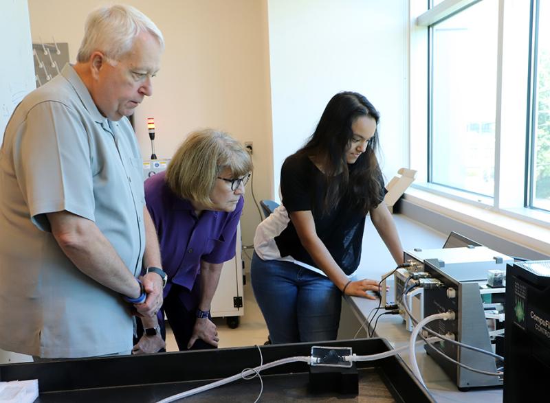 During a lab tour, master’s student Sahar Ibrahim, right, shows Scott and Arline Alexander an example of a 3D-printed vascular structure that can be designed to mimic a specific patient’s anatomy. Ibrahim works with David Frakes, a Coulter BME associate professor. (Photo: Joshua Stewart)