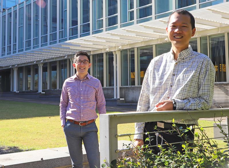 Gabe Kwong, left, and Peng Qiu, who are collaborating on a new project to develop synthetic biosensors capable of basic computing logic. (Photo: Joshua Stewart)