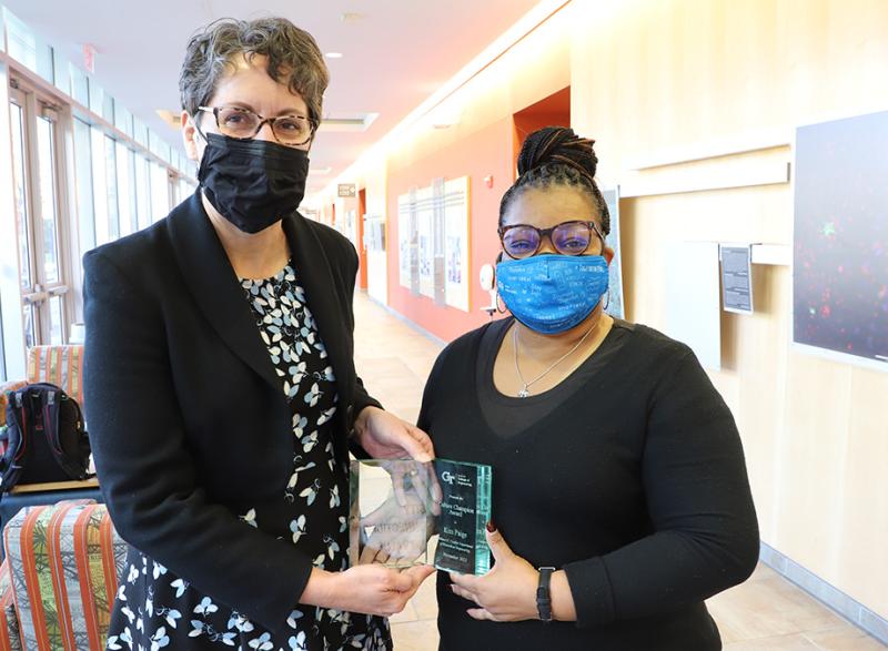 Kim Paige, right, accepts a Georgia Tech College of Engineering 2021 Culture Champion Award from Coulter Department Chair Machelle Pardue. (Photo: Joshua Stewart)
