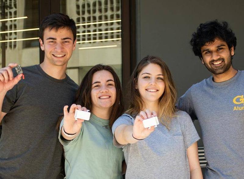 The StrideLink team members display the device and hardware components