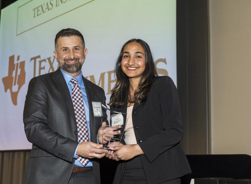 Photo of Sriya Surapaneni holding the Helen Grenga Award Along with BME Senior Academic Professional, Essy Behravesh