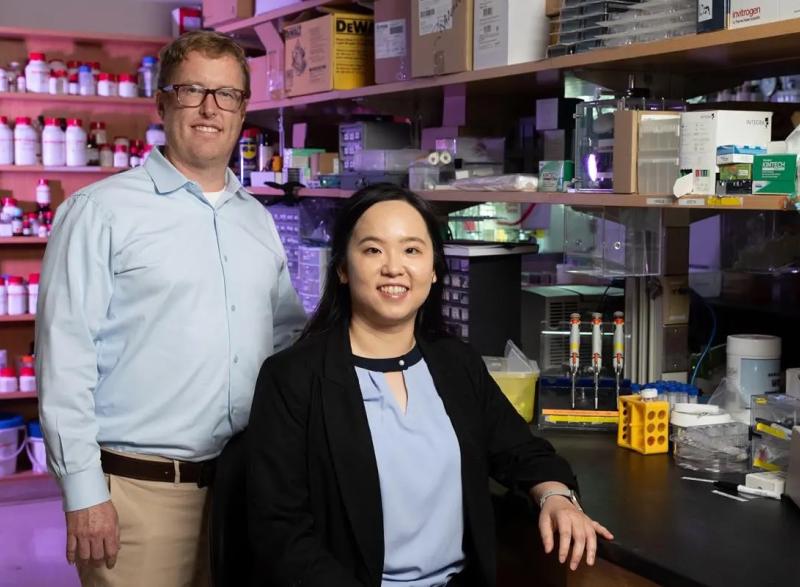 Photo of Coulter BME Professor Brandon Dixon and microsurgeon and Ph.D. student Shao Yun Hsu standing together in Dixon's lab.