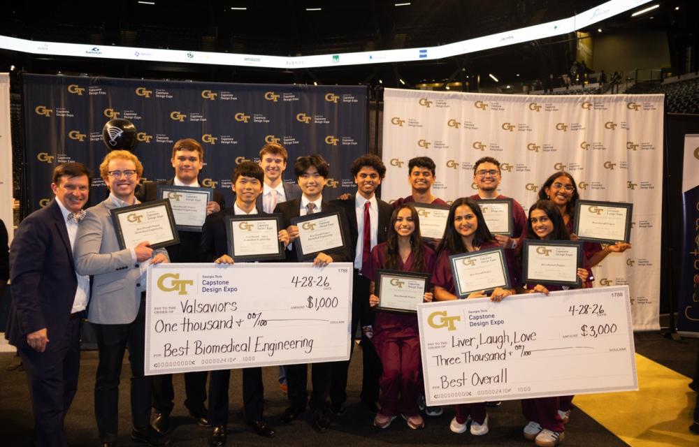 Group photo of Coulter BME Capstone teams. On the far left side of the photo stands Chris Rovell, Profeesor of the Practice and one of the faculty advisors for the BME capstone program. (left to right): Team Valsaviors and Team Liver, Laugh, Love. 
